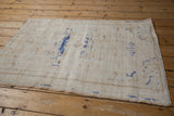Detail of vintage distressed Oushak rug pile showing exposed foundation and cobalt blue.