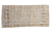 Distressed vintage Oushak runner, faded ivory-beige and green floral medallion, 2'1