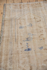 Vintage distressed Oushak rug with mostly even wear to knot heads, ivory, pale blue, and zig-zag motif.