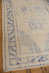 Vintage Distressed Oushak runner, low ivory pile with faded denim blue geometric border.