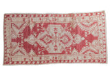 Distressed vintage Oushak runner with central palmette medallion, dusty raspberry red, ivory, 3'2