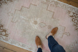 Vintage Distressed Oushak runner showing pale pink, beige, and oxidized silver geometric patterns.