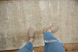 Vintage distressed Oushak rug with subtle tone-on-tone design and textured abrash.