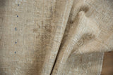 Vintage distressed Oushak rug reverse, with hand-knotted texture and blue processing numbers.