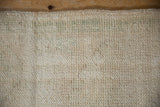 Hand-knotted reverse side of the distressed vintage Oushak rug runner, ivory with subtle green.