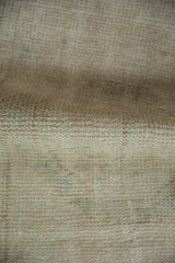 Textured hand-knotted reverse of the vintage distressed Oushak rug runner, showing foundation.