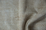 Worn hand-knotted foundation and knot heads on the vintage Oushak rug reverse.