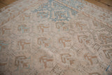 Distressed Oushak rug pattern featuring geometric floral blossoms, dusty blue, and abrashes.