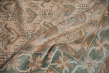 Softly distressed pile of a vintage Oushak rug with color abrashes in seafoam and bronze.