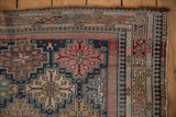 Antique Shirvan rug corner showing intricate geometric details, pawn and starburst motifs.
