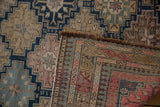 Antique Shirvan rug corner, highlighting fine weave, pawn motifs, and serpent geometric border.