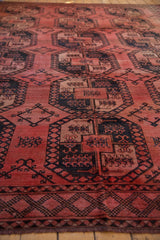 Vintage Ersari carpet with soft, lustrous wool pile and charcoal navy floral gul panels.