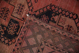 Intact side cord selvedge and hand-knotted geometric weave on the reverse of a vintage Ersari.