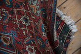 Vintage Hamadan rug pile with detailed Herati pattern in cherry red, teal, and blue.
