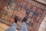 Worn antique Caucasian rug section, highlighting foundation, madder red, indigo, and geometric pawn motifs.
