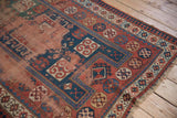 Geometric crab style border, worn madder root red field of an antique Caucasian rug.