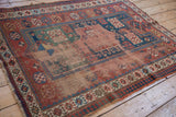 Abrashed madder root red crab style border and reciprocating pawn design motif on an antique Caucasian rug.