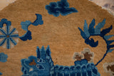Antique Peking rug's intricate sand, cobalt, and indigo floral cloudband motif.