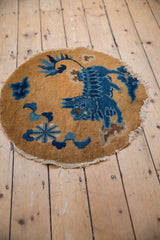 Indigo floral cloudband motifs with fringed edge on antique Peking rug.