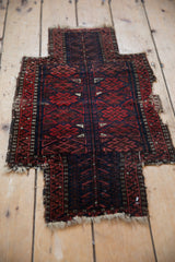 Antique Belouch rug showing madder root red and navy diamond gul motifs.