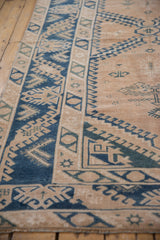 Distressed vintage Melas rug with worn, geometric cobalt blue and teal hook and latch patterns.