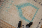 Distressed vintage Oushak square rug, aqua blue prayer mehrab on muted ivory beige.