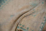 Vintage distressed Oushak rug texture with aqua blue dye lot variations.