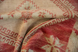 A textural close-up of the soft, hand-knotted pile on a vintage distressed Oushak rug.