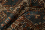 Soft folds of a distressed Hamadan runner showing the low, even pile and time-softened colors.