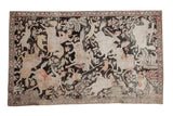 Distressed vintage Qom pictorial rug with charcoal, ivory, and blush hunting scene, 4'4