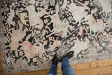 Distressed vintage Qom rug with an intricate pictorial hunting scene in charcoal, ivory, blush.