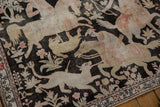 Distressed Qom rug's pictorial hunting scene with soft ivory, blush, and pale copper tones.