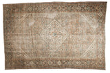 Distressed vintage Hamadan rug with diamond medallion, Herati design, ivory and green tones.