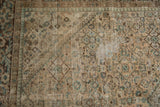 Distressed Hamadan rug pile texture, showing worn Herati design in beige, brown, and dusty green.