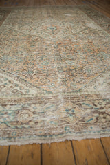 Distressed vintage Hamadan carpet with faded Herati motifs in antique ivory and dusty seafoam.