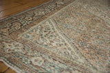 Distressed vintage Hamadan carpet, showing worn Herati design in soft ivory, brown, and seafoam green.