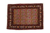 Vintage Farahan Sarouk rug with a repeating boteh design over a sage green field and a rich rust and navy border.