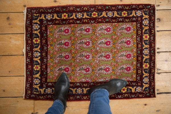 Vintage Farahan Sarouk mat with a sage green boteh pattern, viewed from above to show scale, 2'1