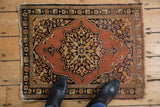 Vintage Tabriz rug with pale rust field, detailed tiered leaves, and serpent borders.