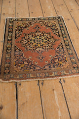 Pale rust field, intricate serpent border, and tattered fringe detail of the Tabriz rug.