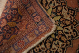 Folded vintage Persian Tabriz rug edge with frayed fringe and visible foundation.