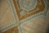 Vintage Distressed Oushak rug with prominent wear and geometric pattern in ivory, bronze, slate.