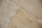 Back of a vintage Turkish Oushak rug showing its hand-knotted foundation and tidy weave.