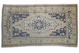 Vintage Distressed Oushak carpet, ivory, dusty navy medallion, geometric floral motifs, 5'11