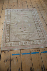 Distressed vintage Oushak rug, faint foundation, tree of life, stepped prayer niche, pink blossoms.