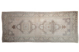 Vintage Distressed Oushak runner with double geometric medallions in muted ivory, mauve, and beige, 4'10