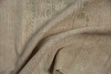 Distressed vintage Oushak rug texture revealing worn knot heads, visible foundation, and faint abrashes.