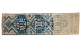 Distressed vintage Oushak runner with cobalt blue geometric medallions, ivory and indigo fading to sand. 2'7