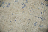 Distressed vintage Sivas carpet showing wear to foundation and cobalt blue floral elements.