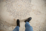 Distressed vintage Sparta carpet with soft, low pile and faded floral arabesque patterns.